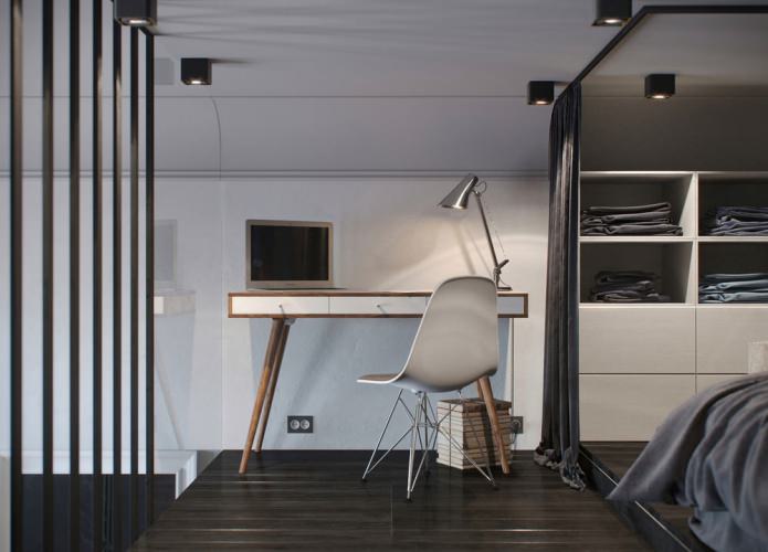 интерьер спальни с рабочим местом в квартире-студии с высокими потолками