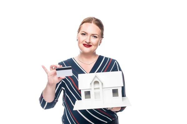Happy Female Estate Agent Showing Maquette New House Credit Card — стоковое фото